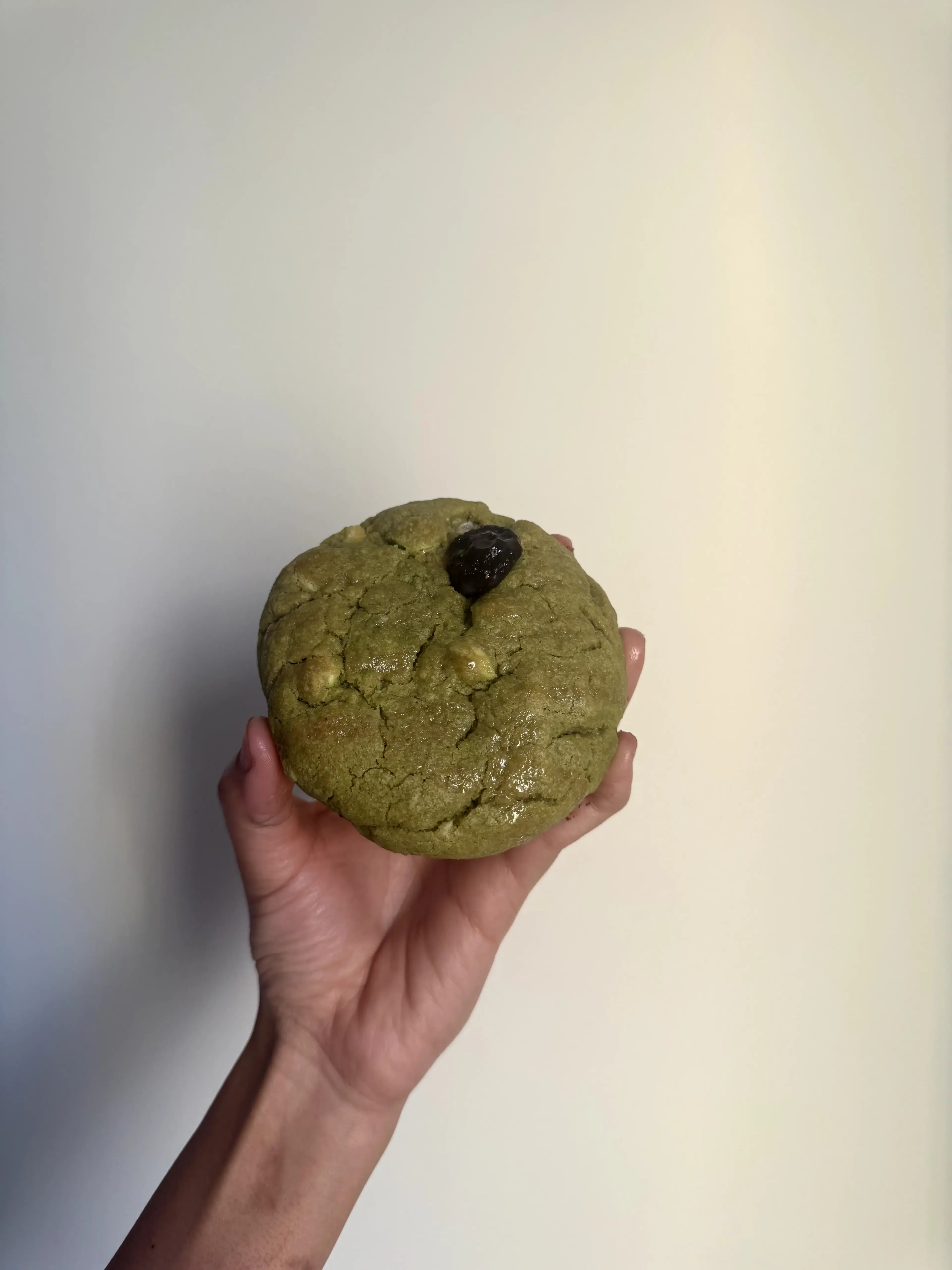 Aidu Bakes Matcha cookie with a vivid green center and white chocolate chunks